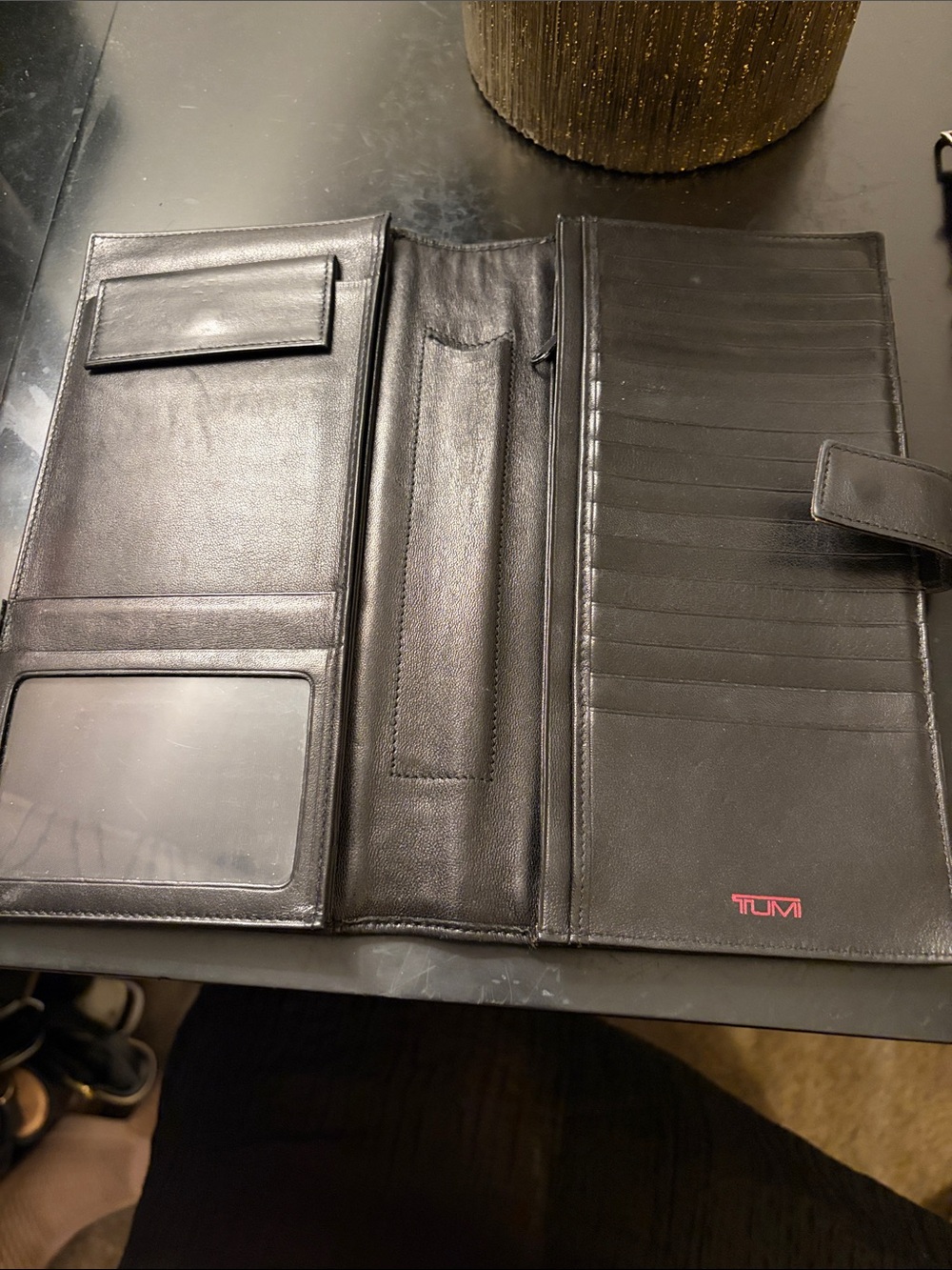 Tumi Black Leather Trifold Travel Wallet with Red Logo (9x5 in.)